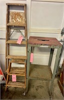 2 wooden ladders  rolling metal work stand