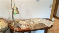 Gold lamp, doilies/table runners