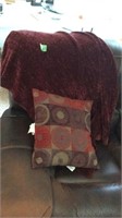 Burgundy throw blanket and pillow