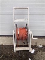 White hose reel with extension cord