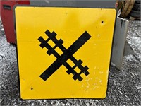 Metal road sign: rail tracks warning
