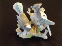 Bird figurine, looks as though a flower is missing