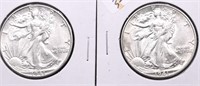 TWO AU WALKING HALF DOLLARS