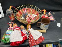 Basket with dolls and other