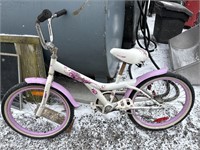 Pink child’s bike