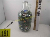 GLASS BOTTLE OF MARBLES