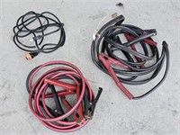 Two sets of jumper cables and extension cord