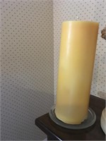 14 inch candle on clear glass candle holder.