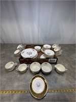 Floral dishware including variety of plates, bowls