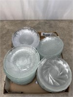 Large assortment of clear glass salad plates