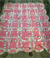 Hand stitched pink double wedding ring quilt
