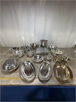Silver plated serving bowls and platters. ice
