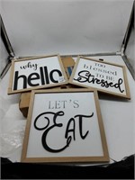 3 black and white hanging wooden signs