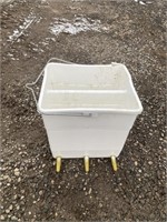 Small white lamb feeder