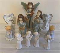 Lot of angel figurines and candleholders