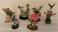 Larger hummingbird figurines with flowers