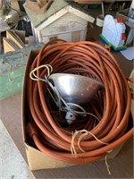Box of extension cords and heat lamp