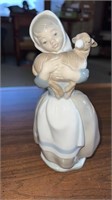 Porcelain Lladro girl holding a lamb figure