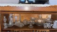 Shelf of miscellaneous glass dishes and more