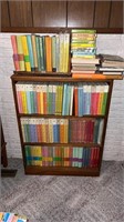 Book case and books approximately 26" x 35”