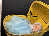 Vintage doll buggy with doll