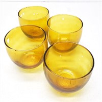 Four round votive candle holders glass