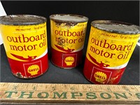 Vintage tin shell outboard motor oil with oil