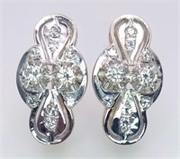 An 18 K white and yellow gold pair of earrings wit