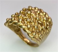 A LARGE AND HEAVY 9K YELLOW GOLD SHOT/KEEPER RING,