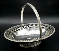 An Antique Sterling Silver Oval Swing Handled Cake