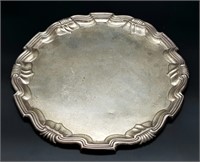 An Antique Sterling Silver Salver with a Decorativ