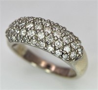An 18 K white gold ring with five round cut diamon