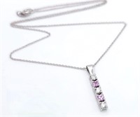 An 18 K white gold drop pendant with diamonds and