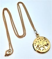 A 9 K yellow gold locket with two loving birds sit