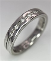 An 18 K white gold, diamond set band ring, size: M
