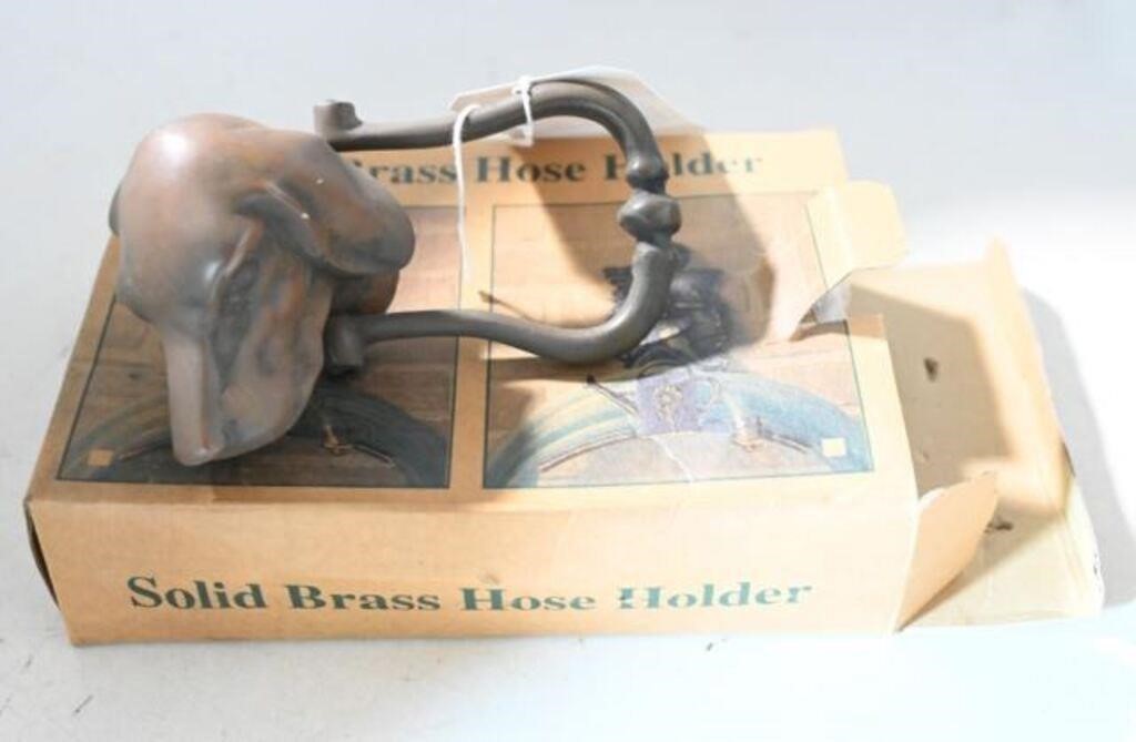 Solid brass hose holder with dog head decoration
