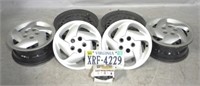 4 - 14" Steel Rims/Wheels w/ plastic hubcaps