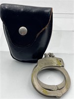 Smokers home- vintage handcuffs and leather case