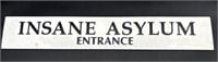 ‘Insane Asylum Entrance’ Sign Embossed on Stone