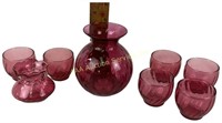 Cranberry glass votives an vases.