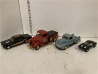 2 model trucks and 2 model cars