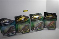 Four Godzilla Figurines. Packaging is Damaged