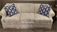 Drexel sofa and blue throw pillows