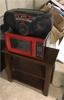 Small TV stand with microwave and radio