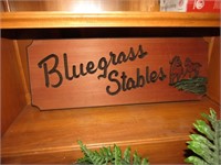 wooden bluegrass stables sign