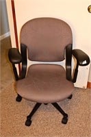 Desk chair; adjustable; shows slight staining in