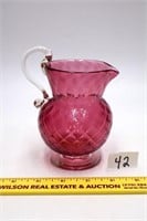 Small cranberry glass pitcher; measures approx. 5
