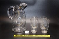 Glass pitcher & (4) matching glasses  Located in