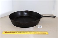 11-inch cast iron skillet; marked Wapak  Located