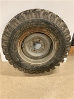 7.50 x 16 grip tire (unused) on 6 bolt split rim